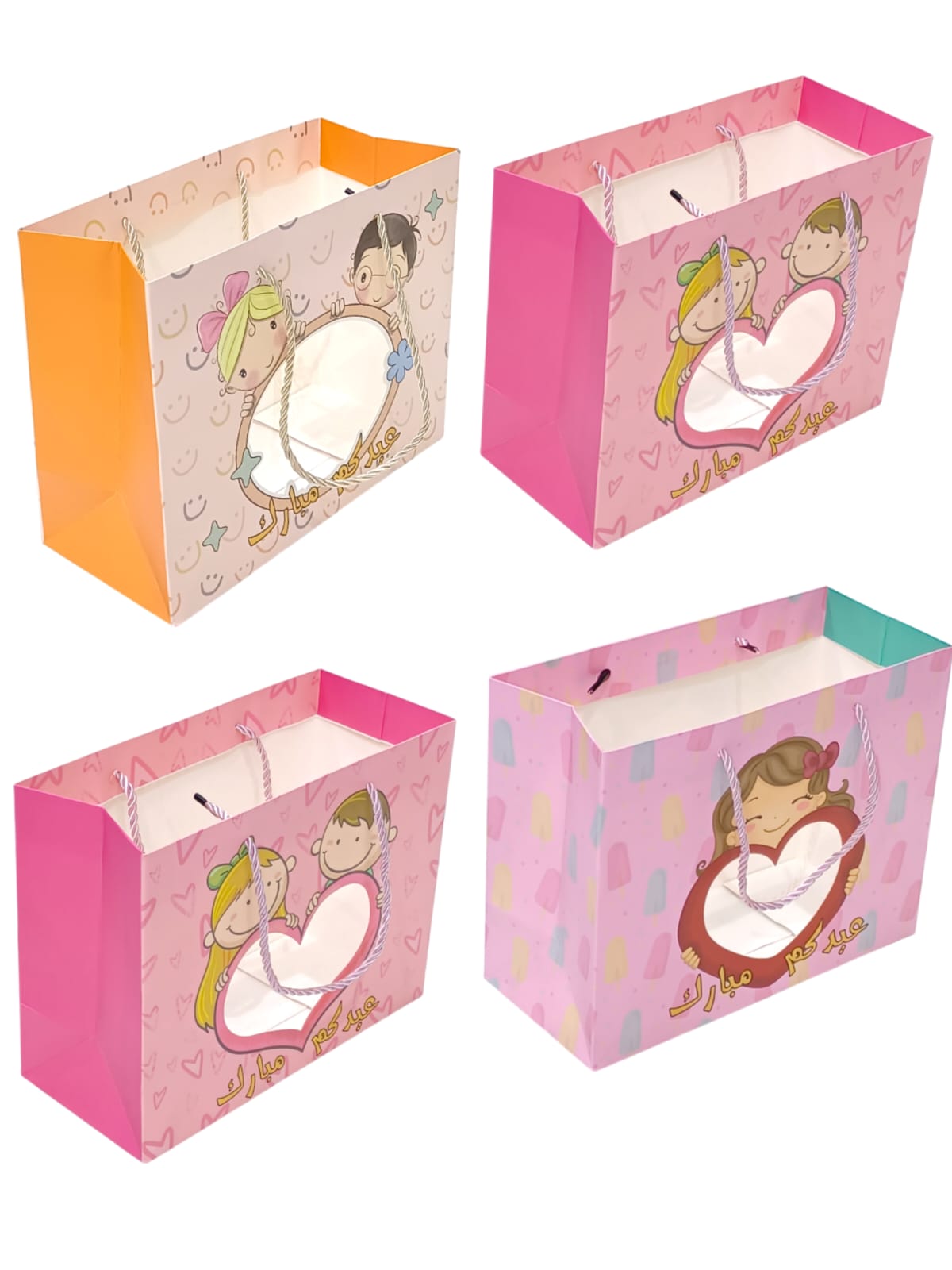 A set of 12-piece gift bags for Eid occasions, 4 colors with a transparent front23*10*18CMM