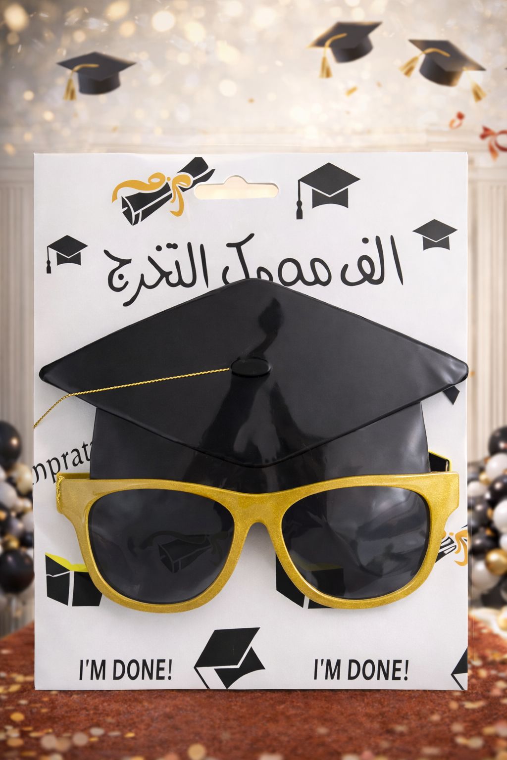 A graduation set that includes graduation sunglasses and a graduation cap.